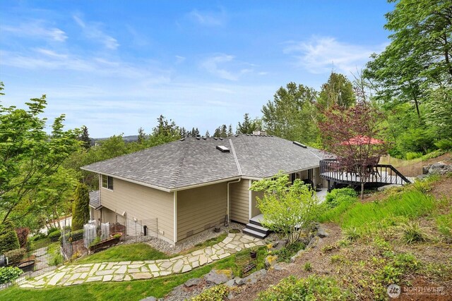 7123 NE 165th St, Kenmore, WA 98028 - rear view of house with a shingled roof and a deck