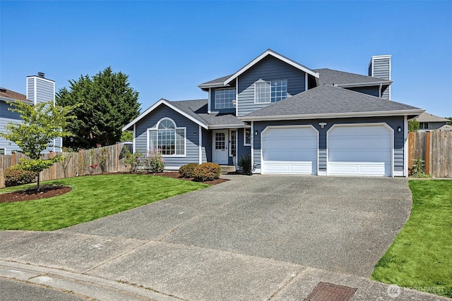 9812 S 247th Ct, Kent, WA 98030 - traditional home featuring asphalt driveway, an attached garage, roof with shingles, and a chimney