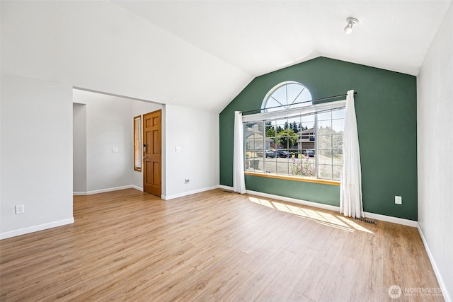 9812 S 247th Ct, Kent, WA 98030 - spare room featuring wood finished floors and vaulted ceiling