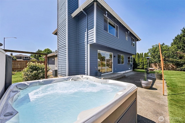 9812 S 247th Ct, Kent, WA 98030 - back of house featuring a hot tub and a patio