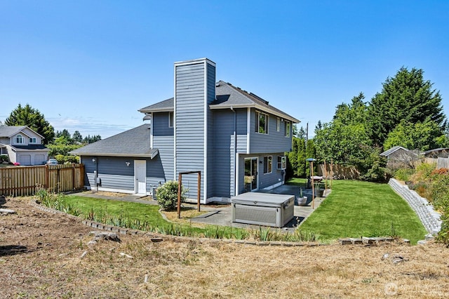 9812 S 247th Ct, Kent, WA 98030 - back of property with a fenced backyard, a chimney, and a shingled roof