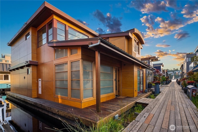2339 Fairview Ave E Unit L, Seattle, WA 98102 - property exterior at dusk with a deck