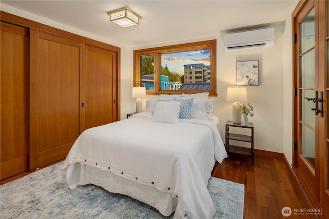 2339 Fairview Ave E Unit L, Seattle, WA 98102 - bedroom with a wall mounted air conditioner, wood finished floors, and a closet
