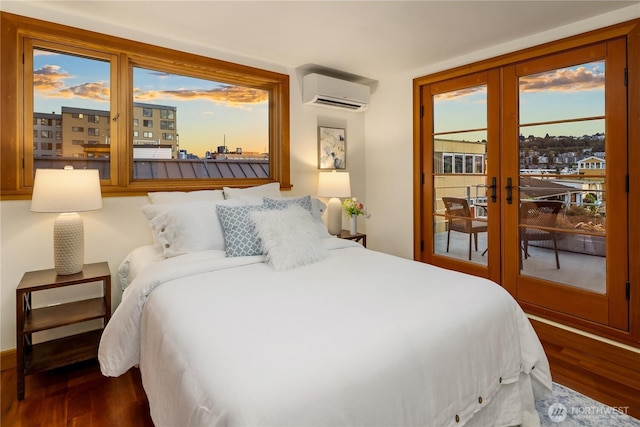 2339 Fairview Ave E Unit L, Seattle, WA 98102 - bedroom featuring access to outside, wood finished floors, a wall unit AC, and french doors