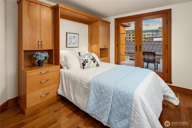 2339 Fairview Ave E Unit L, Seattle, WA 98102 - bedroom featuring access to outside, wood finished floors, and french doors