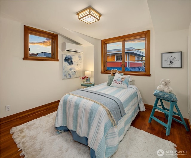 2339 Fairview Ave E Unit L, Seattle, WA 98102 - bedroom featuring a wall unit AC and wood finished floors