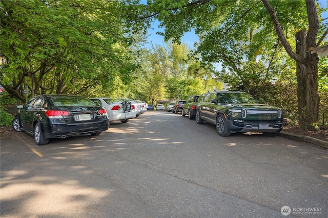 2339 Fairview Ave E Unit L, Seattle, WA 98102 - view of parking featuring view of wooded area