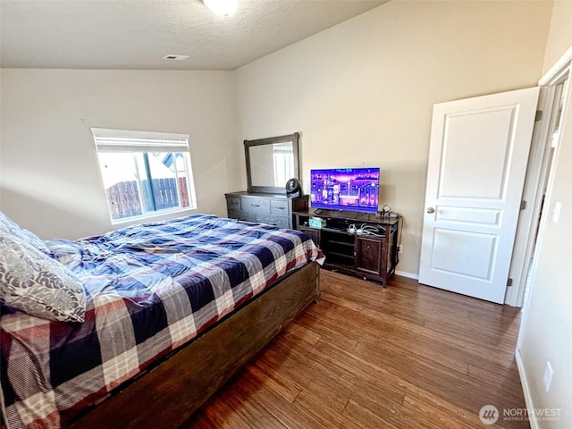 314 SW Homestead, College Place, WA 99324 - bedroom featuring wood finished floors and vaulted ceiling