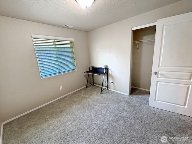 314 SW Homestead, College Place, WA 99324 - unfurnished bedroom featuring carpet, a closet, and a textured ceiling