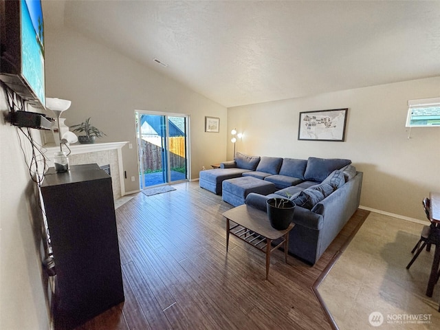 314 SW Homestead, College Place, WA 99324 - living room featuring vaulted ceiling, plenty of natural light, wood finished floors, and a premium fireplace
