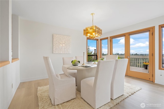 4811 Somerset Dr SE, Bellevue, WA 98006 - dining space featuring a chandelier and light wood-style flooring