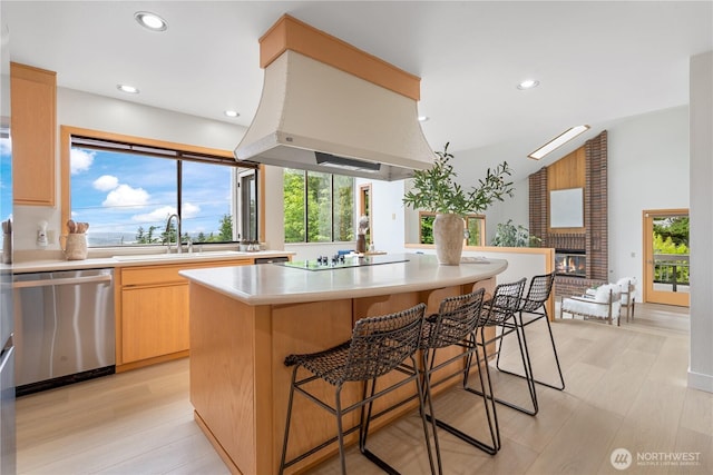 4811 Somerset Dr SE, Bellevue, WA 98006 - kitchen with dishwasher, light countertops, a center island, light wood finished floors, and recessed lighting