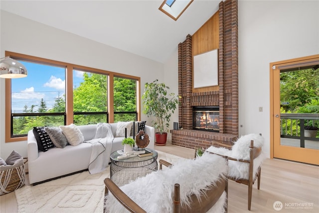 4811 Somerset Dr SE, Bellevue, WA 98006 - living area with high vaulted ceiling, plenty of natural light, light wood-style flooring, and a fireplace