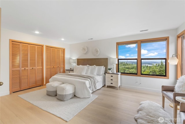 4811 Somerset Dr SE, Bellevue, WA 98006 - bedroom with multiple closets, light wood-type flooring, and recessed lighting