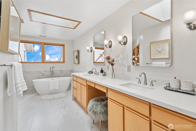 4811 Somerset Dr SE, Bellevue, WA 98006 - full bathroom featuring double vanity, a soaking tub, marble finish flooring, wainscoting, and tile walls
