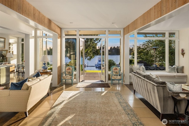 3611 Hunts Point Rd, Hunts Point, WA 98004 - sunroom with tile patterned flooring, healthy amount of natural light, and a water view