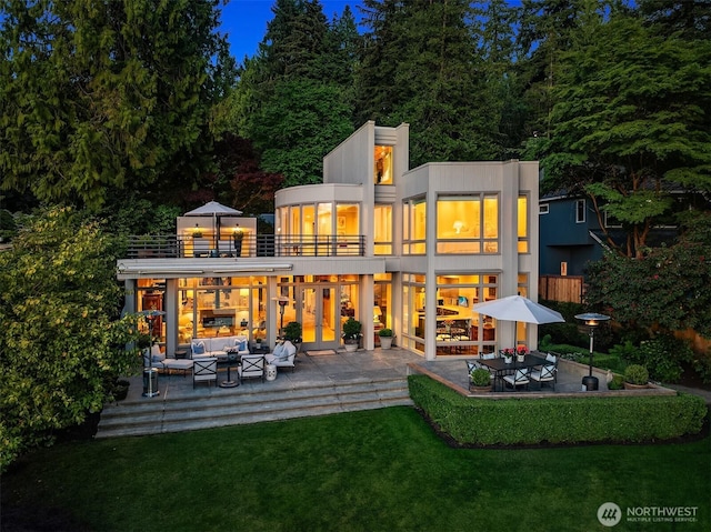 3611 Hunts Point Rd, Hunts Point, WA 98004 - rear view of property featuring a balcony, outdoor lounge area, a lawn, and a patio area