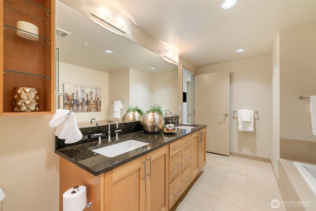 10610 NE 9th Pl Unit 1220, Bellevue, WA 98004 - bathroom featuring double vanity, tiled tub, recessed lighting, and tile patterned floors