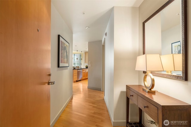 10610 NE 9th Pl Unit 1220, Bellevue, WA 98004 - hall featuring light wood-style floors and baseboards