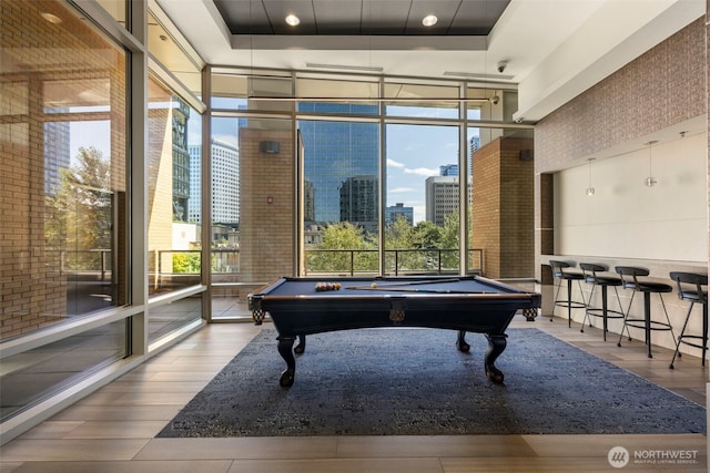 10610 NE 9th Pl Unit 1220, Bellevue, WA 98004 - game room featuring a wall of windows, healthy amount of natural light, pool table, wood finished floors, and recessed lighting
