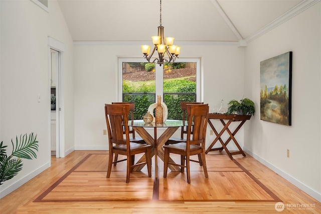 13063 SE 47th Pl, Bellevue, WA 98006 - dining area with lofted ceiling, a chandelier, ornamental molding, and light wood-type flooring