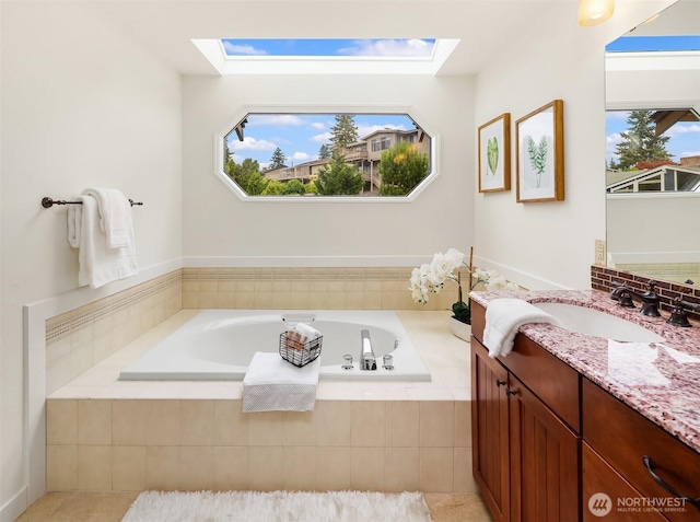 13063 SE 47th Pl, Bellevue, WA 98006 - bathroom with a skylight, vanity, and a garden tub