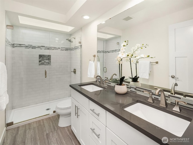 13063 SE 47th Pl, Bellevue, WA 98006 - bathroom featuring recessed lighting, a shower stall, and double vanity