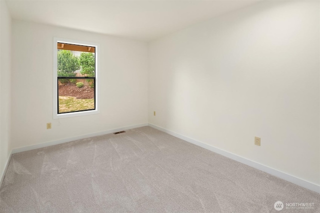 13063 SE 47th Pl, Bellevue, WA 98006 - spare room with light colored carpet and baseboards
