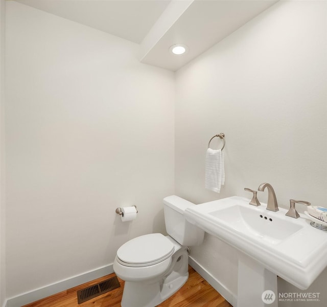 13063 SE 47th Pl, Bellevue, WA 98006 - half bathroom with wood finished floors and recessed lighting