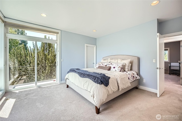 9544 3rd Ave NW, Seattle, WA 98117 - bedroom with light carpet, recessed lighting, and access to exterior