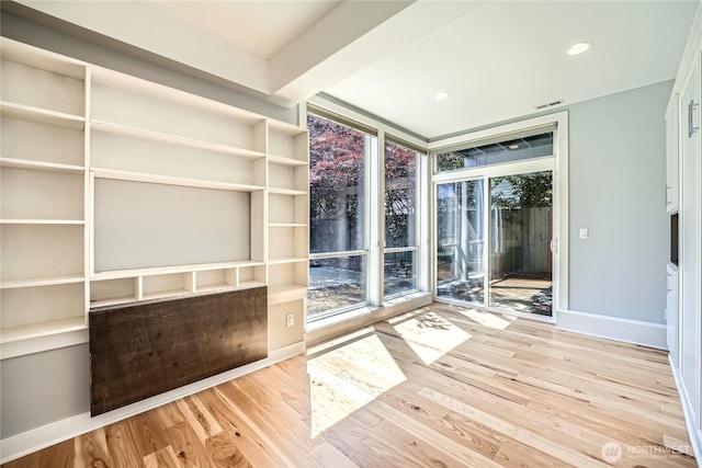 9544 3rd Ave NW, Seattle, WA 98117 - interior space featuring wood finished floors, a wall of windows, and recessed lighting