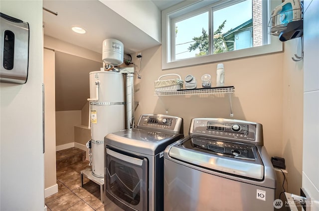9544 3rd Ave NW, Seattle, WA 98117 - laundry room featuring washing machine and clothes dryer, strapped water heater, and tile patterned floors