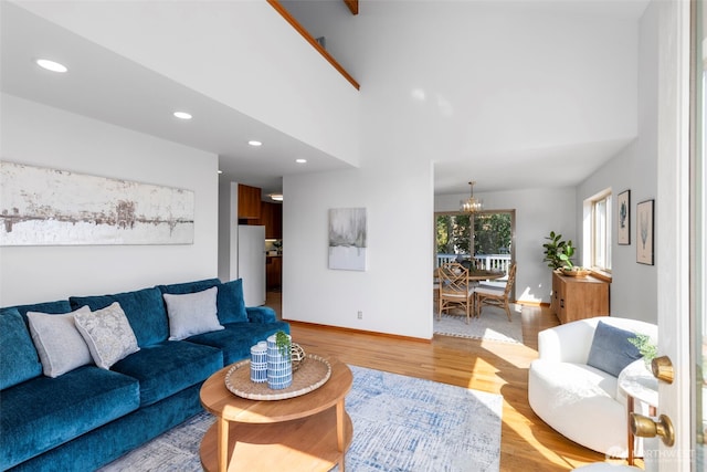 252 Myrtle St, Port Townsend, WA 98368 - living area with light wood-style floors, recessed lighting, a chandelier, and a towering ceiling