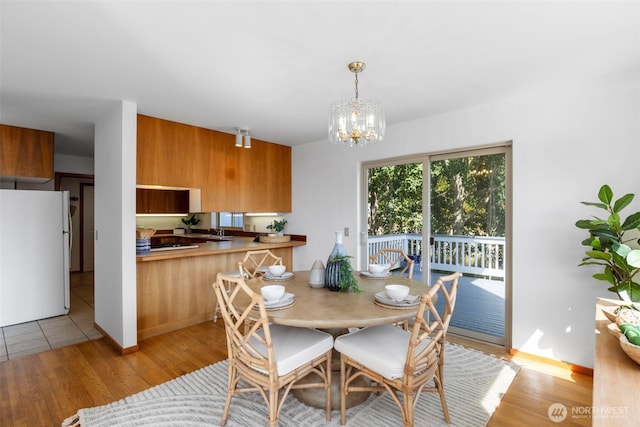 252 Myrtle St, Port Townsend, WA 98368 - dining area with light wood-style floors and a chandelier