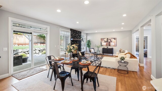 23728 135th Pl SE, Kent, WA 98042 - dining room with a stone fireplace, recessed lighting, and light wood-style flooring