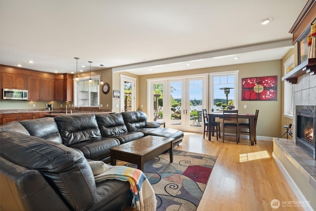 102 E Gibler Ln, Shelton, WA 98584 - living room with light wood-style flooring, a fireplace, french doors, and recessed lighting