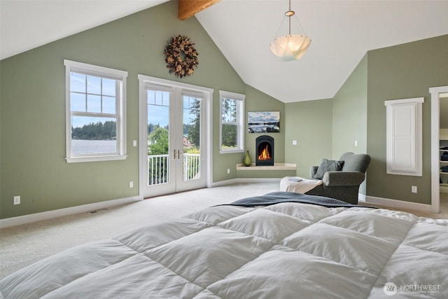 102 E Gibler Ln, Shelton, WA 98584 - carpeted bedroom with access to exterior, beam ceiling, high vaulted ceiling, french doors, and a warm lit fireplace