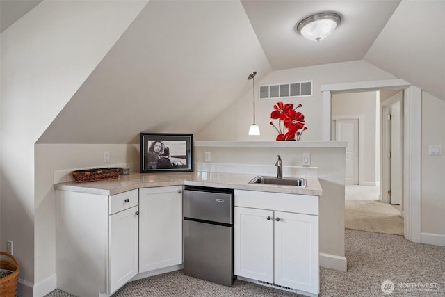102 E Gibler Ln, Shelton, WA 98584 - kitchen with freestanding refrigerator, light carpet, white cabinets, lofted ceiling, and light countertops