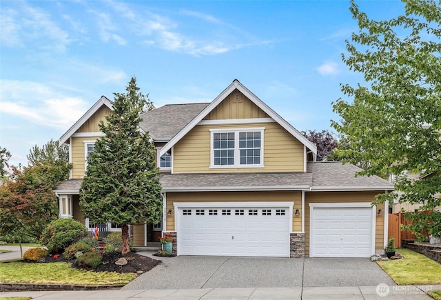 22418 SE 281st St, Maple Valley, WA 98038 - view of front of home featuring board and batten siding, driveway, roof with shingles, and a garage