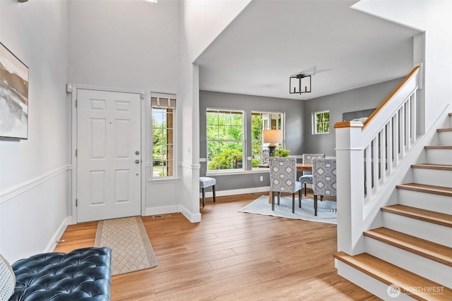 22418 SE 281st St, Maple Valley, WA 98038 - foyer featuring stairs and light wood-style floors