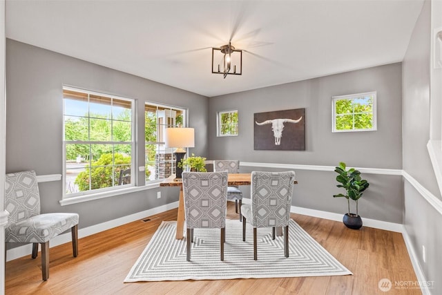 22418 SE 281st St, Maple Valley, WA 98038 - dining room featuring wood finished floors