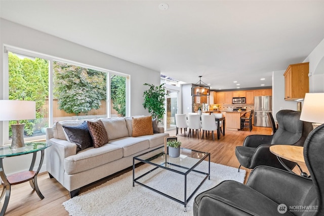 22418 SE 281st St, Maple Valley, WA 98038 - living area featuring light wood-type flooring and recessed lighting