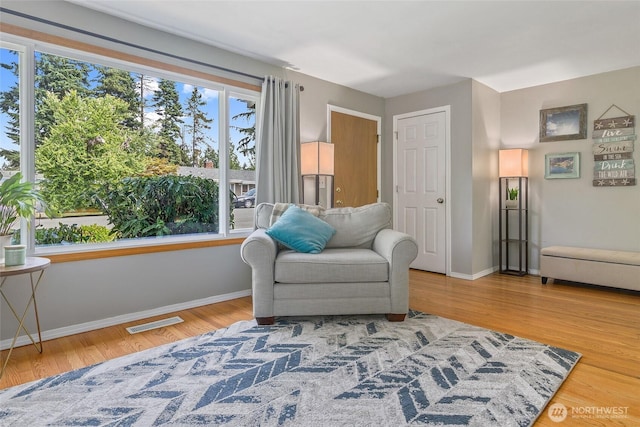 3041 S 201st St, Seatac, WA 98198 - sitting room with light wood finished floors and baseboards