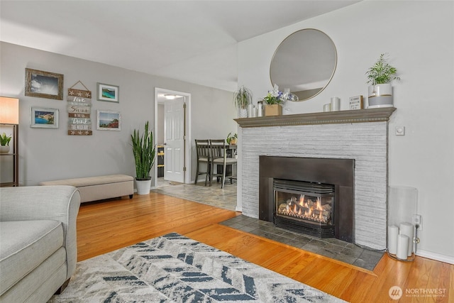 3041 S 201st St, Seatac, WA 98198 - living room with wood finished floors and a brick fireplace
