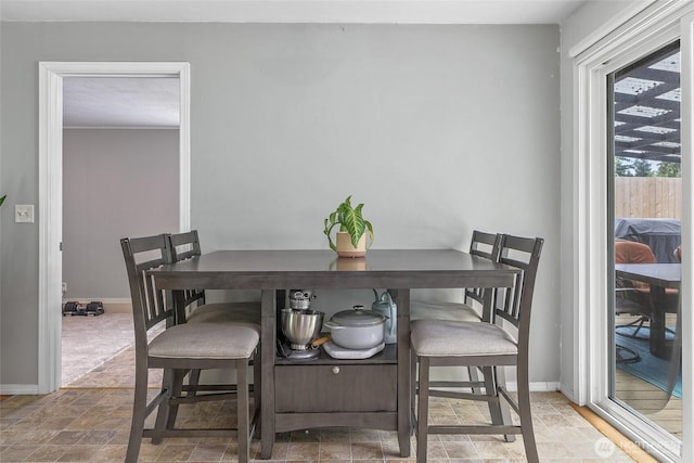 3041 S 201st St, Seatac, WA 98198 - dining room featuring baseboards and stone finish flooring