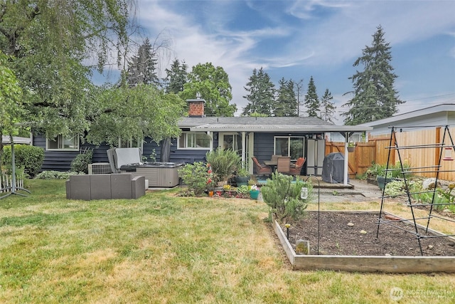 3041 S 201st St, Seatac, WA 98198 - rear view of house with a vegetable garden, a chimney, and a patio area