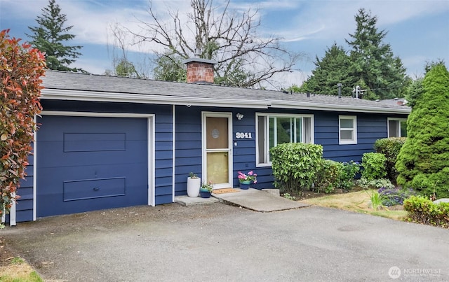 3041 S 201st St, Seatac, WA 98198 - ranch-style home with a chimney and a garage
