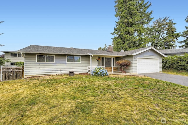 202 Elma Pl SE, Renton, WA 98059 - ranch-style house featuring an attached garage, asphalt driveway, a chimney, and a porch