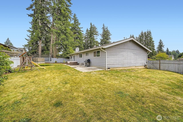 202 Elma Pl SE, Renton, WA 98059 - fenced backyard featuring a patio and a playground