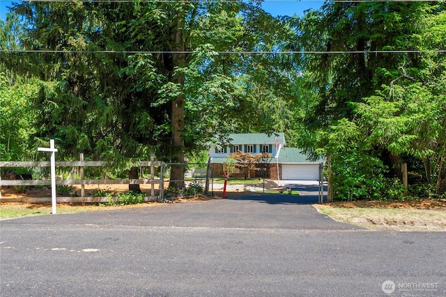 29701 52nd Ave E, Graham, WA 98338 - obstructed view of property featuring a garage and asphalt driveway